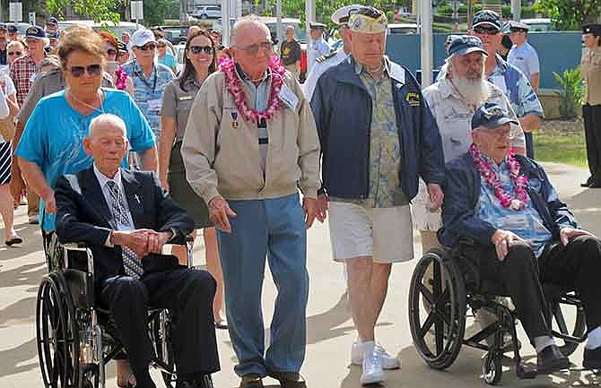 USS Arizona survivors from left, John Anderson, Don Stratton, Louis Conter and Lauren Bruner arrive Tuesday, Dec. 2, 2014, in Pearl Harbor, Hawaii. Four of the remaining nine USS Arizona survivors of the Pearl Harbor attack are vowing this year's anniversary of the 1941 attack won't be their last reunion. Even though it's the last official survivor gathering of the USS Arizona Reunion Association, the men say they still plan to get together, even if not in Hawaii. Sunday marks the 73rd anniversary of the Japanese attack that killed roughly 2,400 sailors, Marines and soldiers.