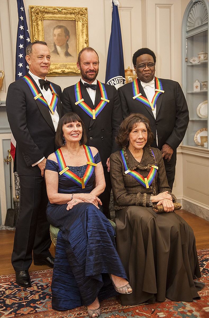 From left, 2014 Kennedy Center Honorees Tom Hanks, Patricia McBride, Sting, Lily Tomlin and Al Green pose for a photo following the State Department Dinner for the Kennedy Center Honors on Saturday at the State Department in Washington.