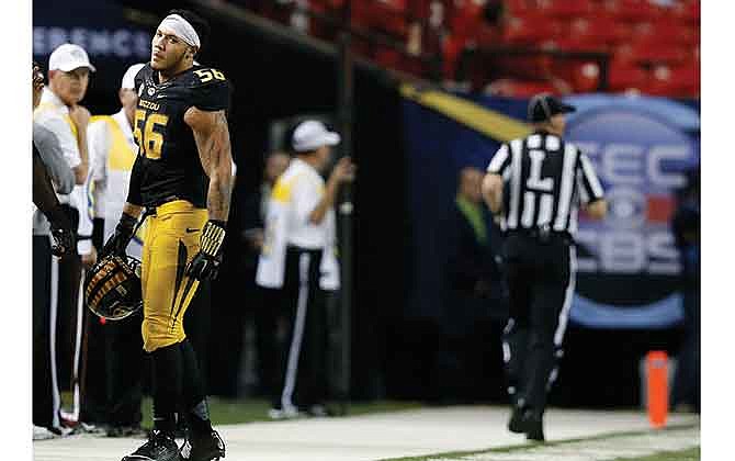 Missouri defensive lineman Shane Ray walks off the field Saturday after being ejected in the first half of the Southeastern Conference championship game after a targeting penalty on a hit against Alabama quarterback Blake Sims in Atlanta.