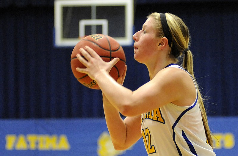 Fatima guard Sammey Bunch takes aim before burying a 3-pointer in the first half of Monday's game with St. Elizabeth in Westphalia.