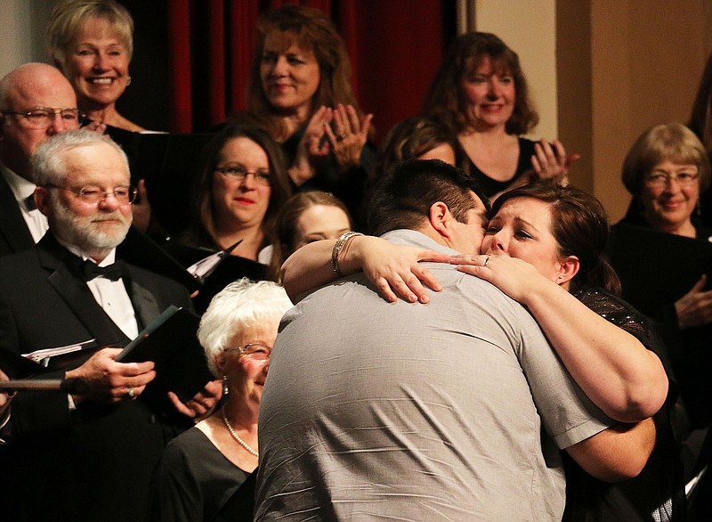Dakotah Luttrell hugs Hilary Miller shortly after proposing to her on stage at the Callaway Singers "Sendin' You a Little Christmas" concert Thursday night - she said yes. Luttrell said he wanted to ask Miller to marry him and thought the concert was a good opportunity to do so because their families could be there. Luttrell said having family there, especially Miller's family, when he proposed was important to him.