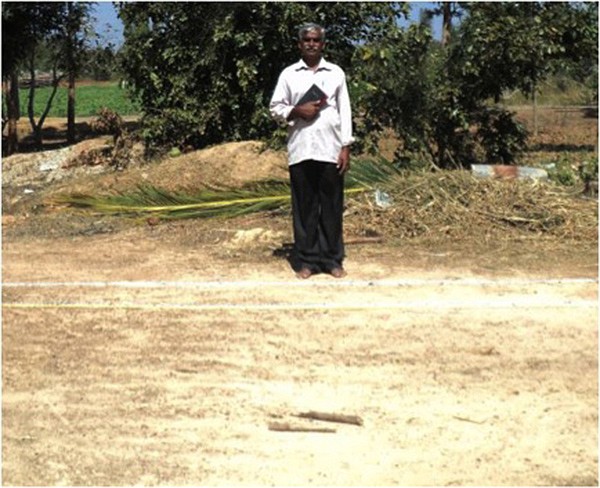 Pastor Obanna stands on the site where the Golla Church in Karnataka, India, is being built, thanks to the donations collected through three Jefferson City congregations.