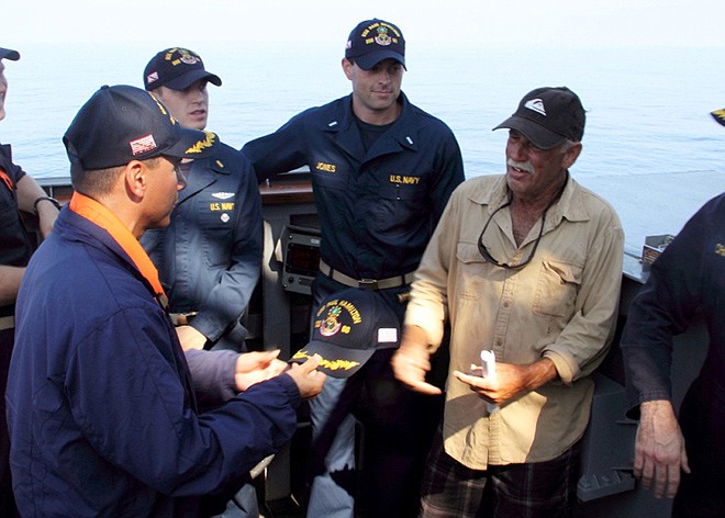 Cmdr. John Barsano welcomes Ron Ingraham aboard the Arleigh Burke-class guided-missile destroyer USS Paul Hamilton after rescuing him on Tuesday near Hawaii.  Ingraham, 67, was found dehydrated and hungry after going missing on Thanksgiving, when the Coast Guard picked up his mayday call saying his boat was in danger of sinking.