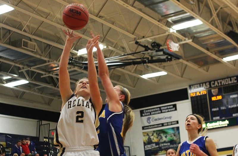 Morgan Wieberg of Helias goes up for a basket during Thursday night's game against Fatima at Rackers Fieldhouse.