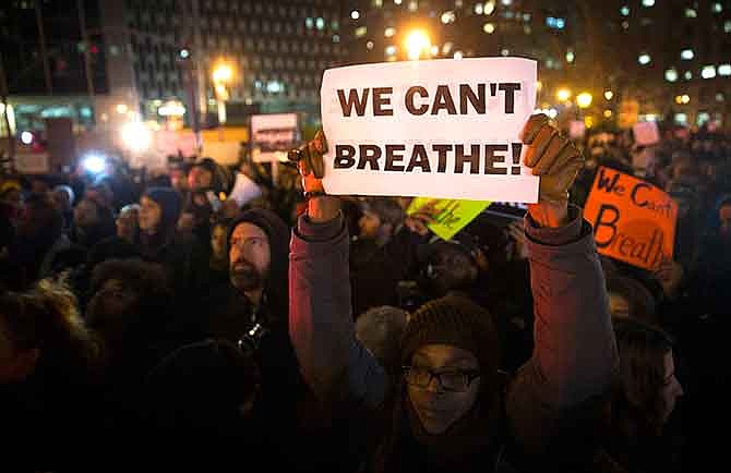 In this Dec. 4, 2014 file photo, demonstrators participate in a rally against a grand jury's decision not to indict the police officer involved in the death of Eric Garner, in New York. Who, if anyone, is leading the emerging movement around the deaths of Michael Brown and Eric Garner -- younger activists or legacy civil rights groups? The legacy civil rights organizations - the National Action Network, the NAACP, the National Urban League - last week called for people to coalesce on Saturday for a national march with the families of Michael Brown and Eric Garner, unarmed black men who have died at the hands of white police officers. Grand juries refused to indict the white police officers in those cases.