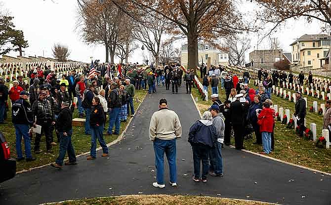 A crowd gathers Saturday morning, Dec. 13, 2014 before the start of the Wreaths for Heroes ceremony at Jefferson City National Cemetery.
