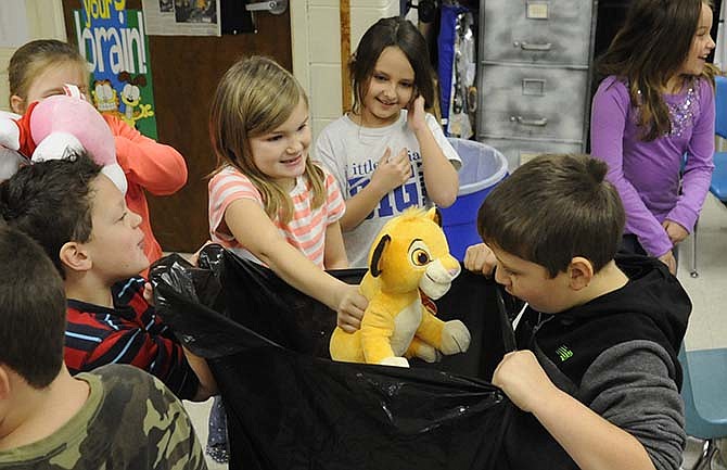 Students in Sarah Kennedy's Russellville Elementary School second-grade classroom have been collecting stuffed animals to donate to the patients at St. Louis Children's Hospital this Christmas. A fellow classmate, Maelynne Cartee, has been a patient there the last few months, after sustaining a head injury from being trampled by a cow.