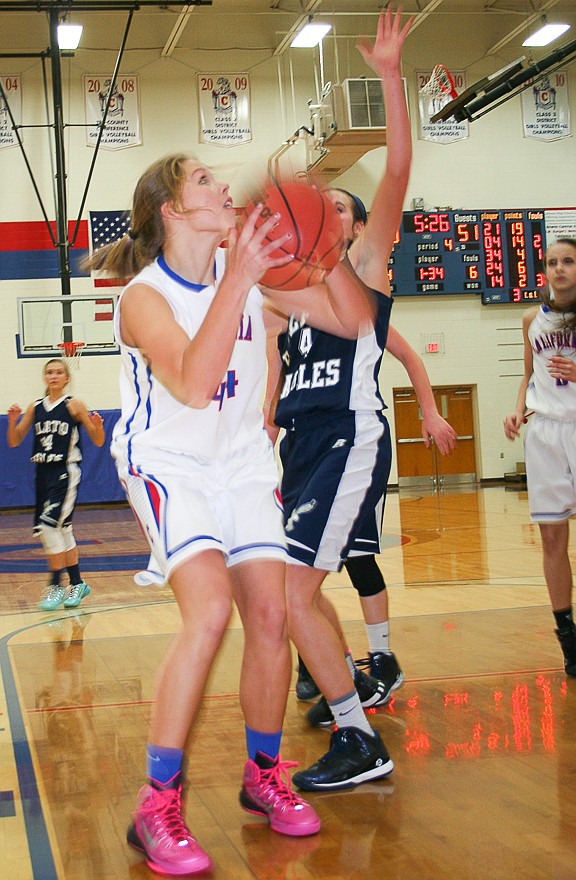California sophomore Cameron Meyer (44) goes up for a shot attempt as a Plato defender closes in. Meyer scored five points in her team's 60-51 loss to the Lady Eagles on Thursday, Dec. 11.