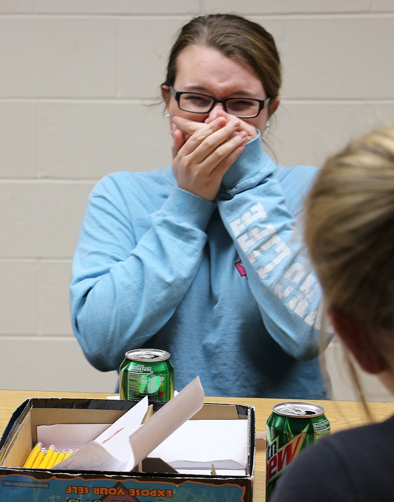 South Callaway student Cayla Loucks laughs as she thinks of her answer to a question at FFA's game night Wednesday. The group played the board game Loaded Questions.