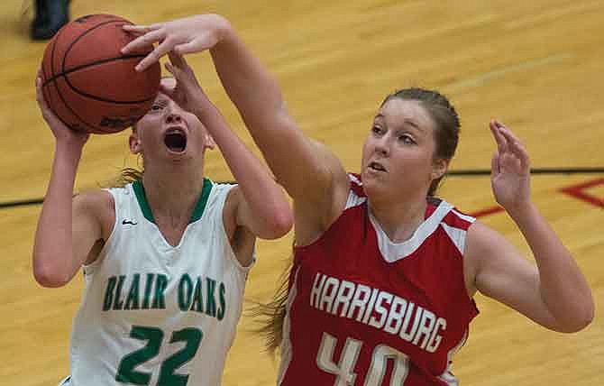 Chelsi Emerson of Blair Oaks puts up a shot against Harrisburg's Bailey Ivicsics during the third quarter of
Saturday's game in the Missouri National Guard Shootout at Fleming Fieldhouse in Jefferson City.