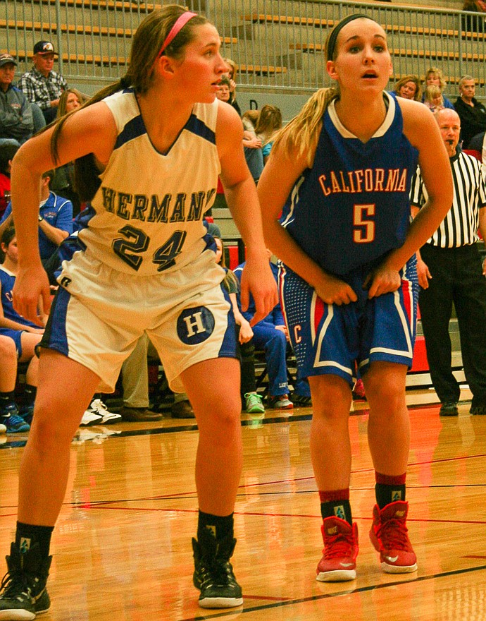 California sophomore Cassie Dearixon (5) and Hermann freshman Tess Schannuth (24) get into position during a free-throw attempt at Saturday's National Guard Shootout in Jefferson City. The Lady Pintos won, 49-39.