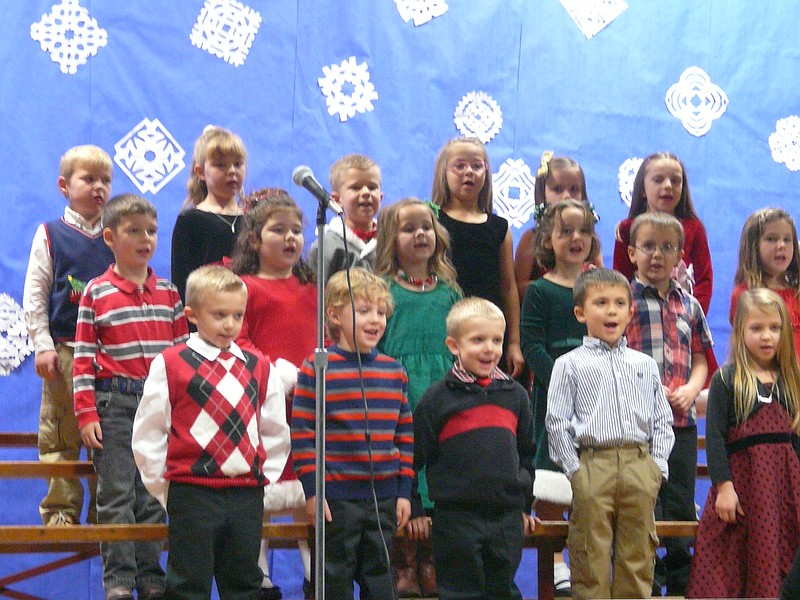 High Point Kindergarten and first grade students sing out "Rudolph the Red Nose Reindeer" during their Christmas program Thursday, Dec. 18.