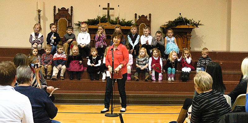 Democrat photo 
At the beginning of the Aurora Montessori Christmas program, teacher Angie Lehman speaks to the family and friends present for the event.