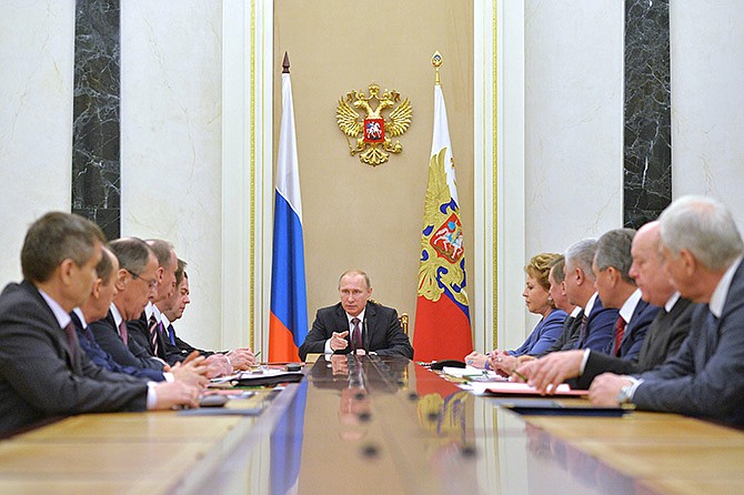 Russian President Vladimir Putin, center, heads the Security Council in Moscow's Kremlin, Russia on Friday.