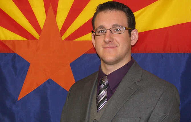 This Nov. 27, 2008 photo released by the Flagstaff Police Department, shows police officer Tyler Stewart. Officer Stewart, 24, died Saturday, Dec. 27, 2014, at Flagstaff Medical Center after he was shot by a suspect in a domestic-violence case, police said. 