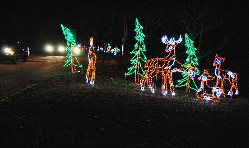 Dozens of cars regularly tour the new holiday light park each evening at Osage Beach City Park, viewing a variety of displays including this winter-themed deer scene.