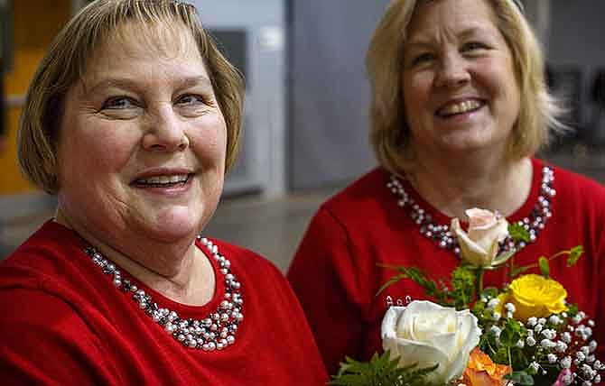 Twins Yvonne Garrard, left, and Yvette Joyce were thrown a birthday party Saturday at the First Assembly of God Church in Jefferson City. With the twins' birthday falling so close to Christmas, the two were never given a large-scale birthday party. Their older sister, Sharon Grant, took it upon herself to design them the perfect party.