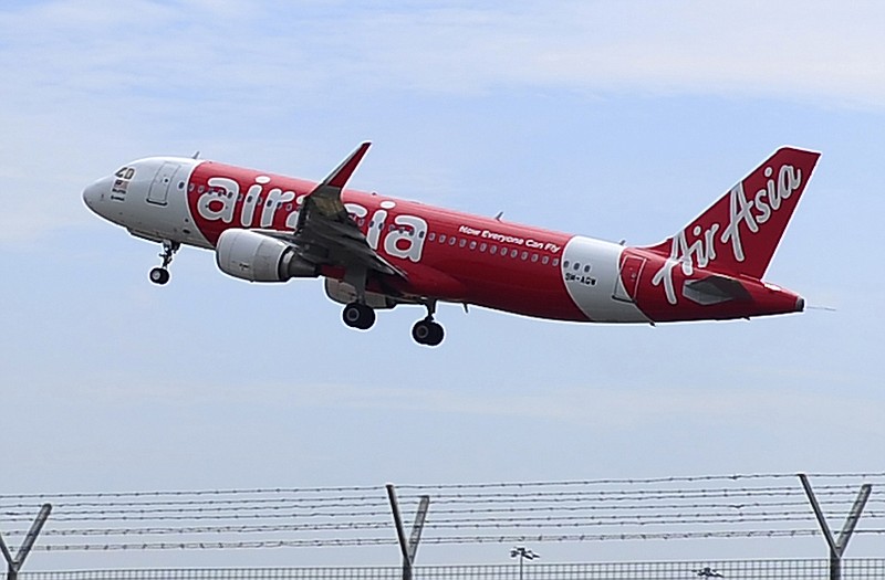 An AirAsia A320-200 plane takes off from Kuala Lumpur International Airport 2 in Sepang, Malaysia. An AirAsia plane with 162 people on board went missing on Sunday while flying over the Java Sea after taking off from Surabaya, Indonesia for Singapore. The plane in this photo is the same model but not the one which went missing in Indonesia Sunday. 
