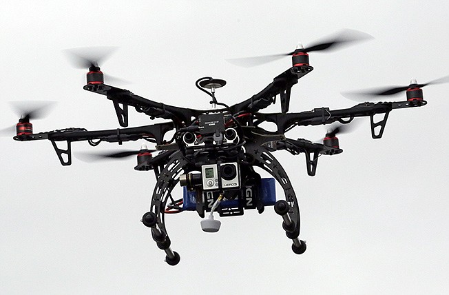 A rescue drone is flown by Box Elder County Sheriff's Office during a demonstration in Brigham City, Utah. The Obama administration is on the verge of proposing long-awaited rules for commercial drone operations in U.S. skies, but key decisions on how much access to grant drones are likely to come from Congress next year.