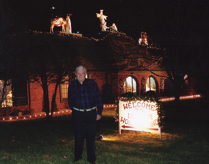 Jack Steppelman stands in front of his house at 1122 Leslie Blvd. while his Winter Wonderland is on display.