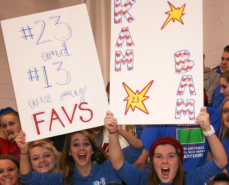 Go Team!: California seniors (from left) Megan Sansing and Rylee Glenn made signs to help support the Lady Pintos basketball team earlier this season.
