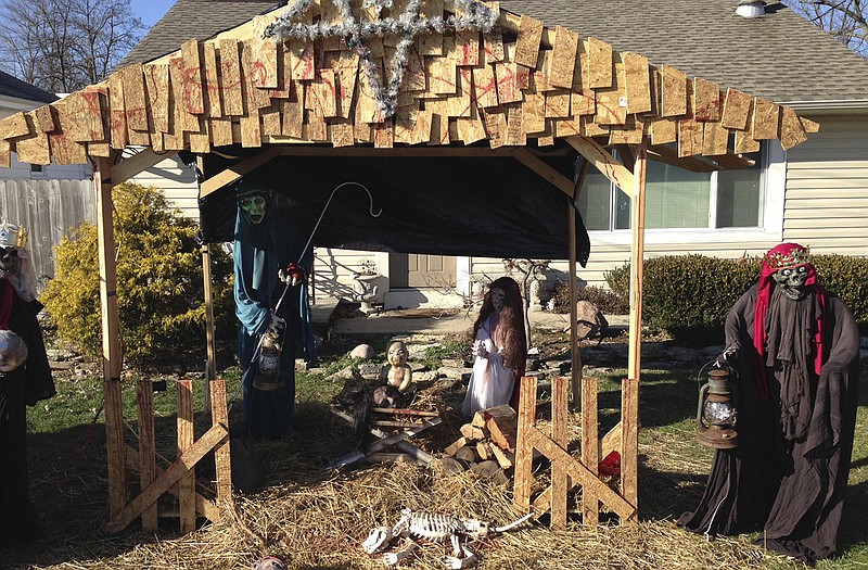 A "Zombie Nativity" scene stands on the front yard of Jasen Dixon's home in Sycamore Township, Ohio, near Cincinnati. Township officials notified Dixon that the display violates zoning rules on size and placement of yard structures.