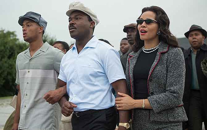 This photo released by Paramount Pictures shows, David Oyelowo, center, as Martin Luther King, Jr. and Carmen Ejogo, right, as Coretta Scott King in the film, "Selma."