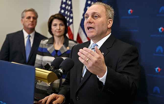 In this Nov. 18, 2014 file photo, House Majority Whip Steve Scalise of La., right, with House Majority Leader Kevin McCarthy of Calif., left, and Rep. Cathy McMorris Rodgers, R-Wash., speaks to reporters on Capitol Hill in Washington, following a House GOP caucus meeting. Scalise acknowledged that he once addressed a gathering of white supremacists. Scalise served in the Louisiana Legislature when he appeared at a 2002 convention of the European-American Unity and Rights Organization. Now he is the third-highest ranked House Republican in Washington.