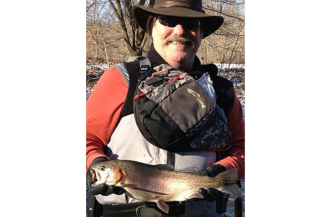 Milt Barr with a rainbow trout.
