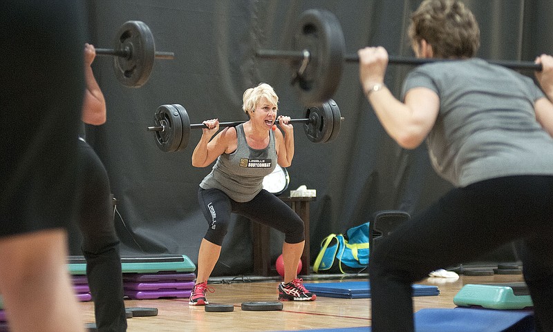 Jill Luebbert, a BODYPUMP instructor at the YMCA of Callaway County, leads a free class Saturday morning. The YMCA offered free classes in BODYPUMP, BODYCOMBAT, step and cycling. It also has discounted joining fees for the month of January - when many make New Year's resolutions to become healthier.