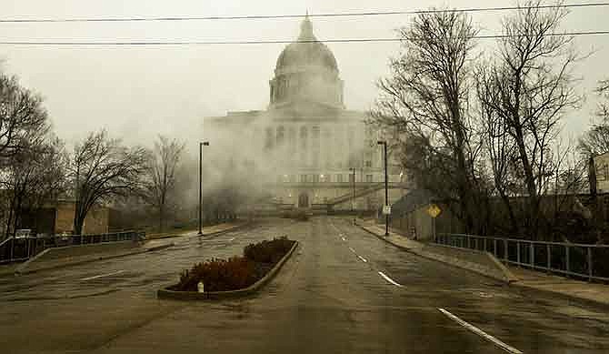 Fog shrouds the Missouri Capitol early Saturday morning as Friday's cold, rainy weather continued into the weekend. Due to a mild to weak El NiÃ±o, forecasters predict a winter with little snow accumulation for Central Missouri.