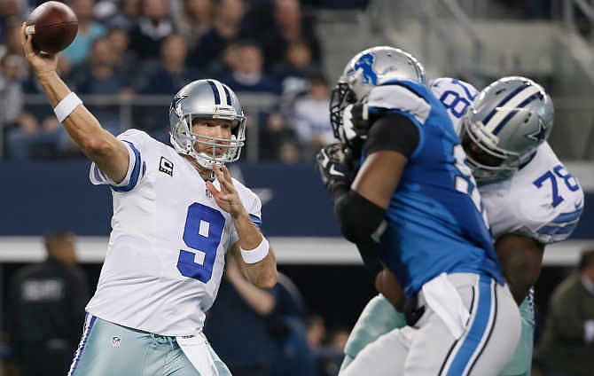 Dallas Cowboys quarterback Tony Romo (9) throws a pass during the first half of an NFL wildcard playoff football game against the Detroit Lions, Sunday, Jan. 4, 2015, in Arlington, Texas.