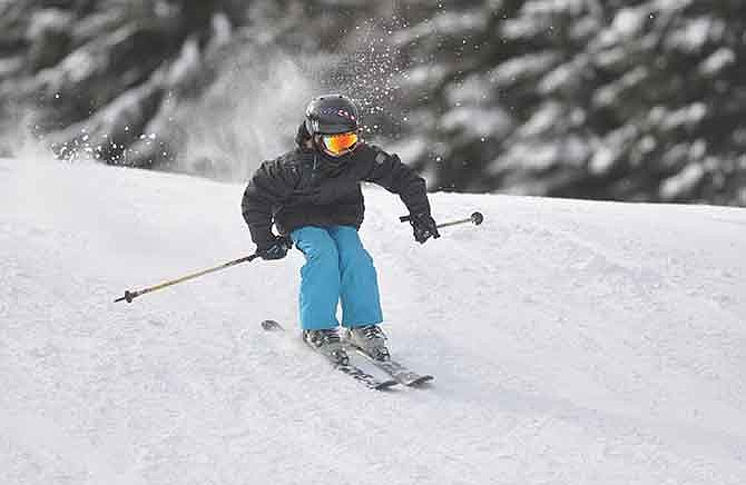 A young skier rides down a hill at the Wildwood ski resort. Hidden Valley is one of two ski destinations in Missouri. 