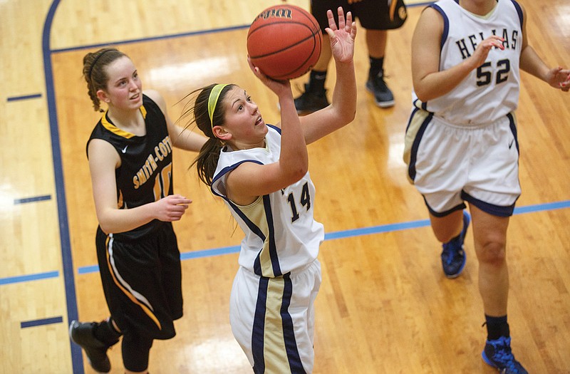 Helias guard Ashley Rehagen puts up a layup Tuesday evening during the Lady Crusaders' game against Sedalia Smith-Cotton at Rackers Fieldhouse. 