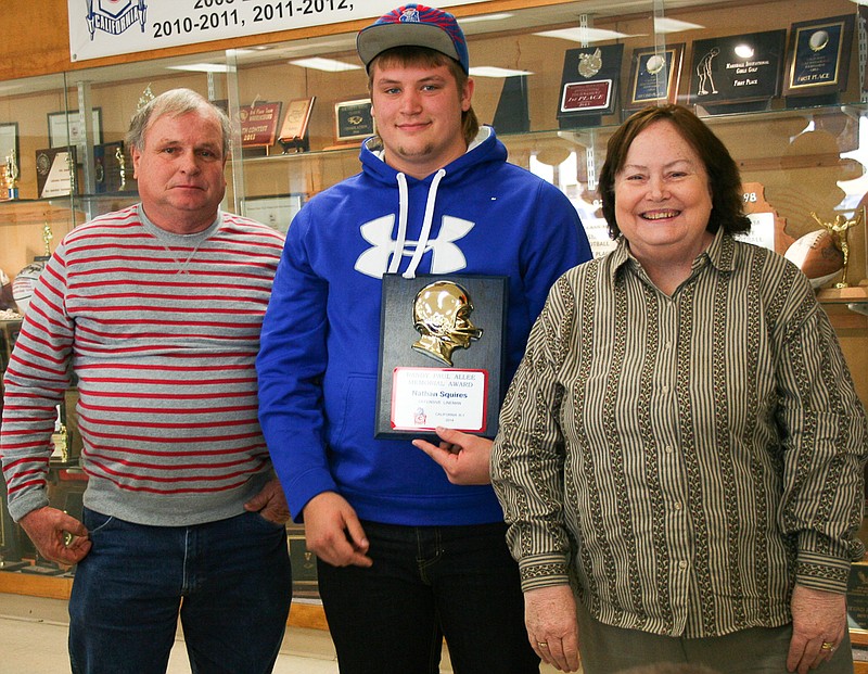 California senior Nathan Squires (center) was awarded the Randy Allee Memorial Scholarship at Sunday's football banquet. Randy's parents, Paul and Suzy, were there to help honor Squires.