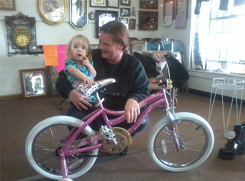 The winner of the drawing for the girls 18-inch bike was Riley Porter, 2, daughter of Lindsey Porter and Rick Brotherton.