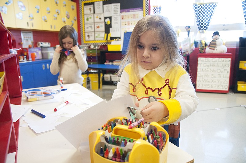 Lillian Purcell, a kindergartener at Bartley Elementary School, cuts paper in the shape of a diamond for a crown during playtime on Wednesday. Purcell dressed up as Jesse, the cowgirl from the "Toy Story" animated movie series for Fulton Public Schools' Disney Day. This week is spirit week for the district, pumping up students, staff and faculty for the winter homecoming basketball games against Mexico on Friday night. Court warming king and queen will be announced in between the girls and boys games.