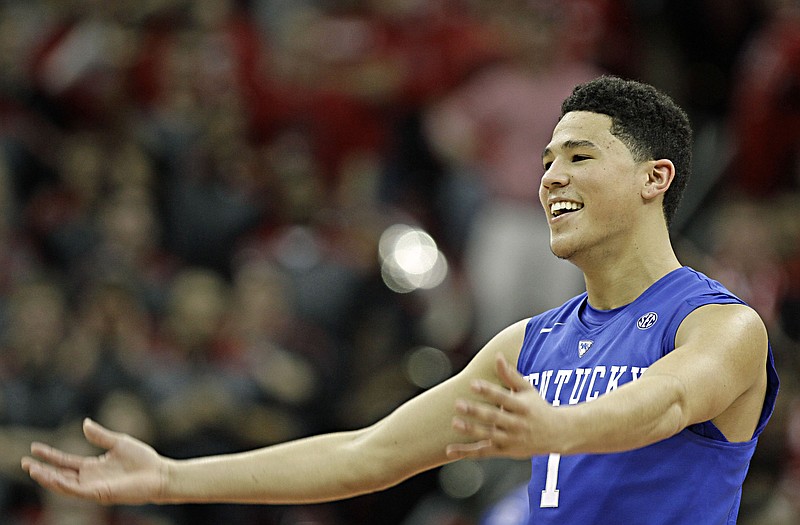 Kentucky freshman guard Devin Booker celebrates after a win last month against Louisville in Louisville, Ky. Booker, the son of former Missouri guard Melvin Booker, and the Wildcats will host the Tigers tonight in Lexington, Ky.