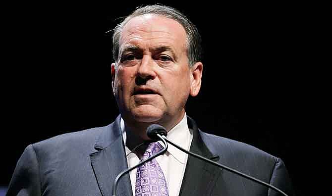 In this Aug. 9, 2014 file photo, former Arkansas Gov. Mike Huckabee speaks in Ames, Iowa.