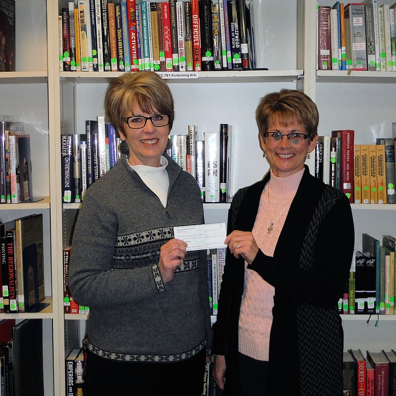 Laura Burger, President of the Elia Wood Paegelow Foundation presents a check for $5,000 to Connie Walker, County Library Director. These funds were a special gift for the Moniteau County Library @ Wood Place facility in California from the E.M. Burger Foundation.