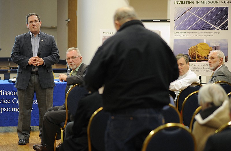 Warren Wood, Ameren Missouri vice president for legislative and regulatory affairs, left, listens as a member of the audience asks for details about some of the fees on his bill during a question and answer session prior to the start of Wednesday evening's Missouri Public Services Commission hearing regarding Ameren's rate increase request.
