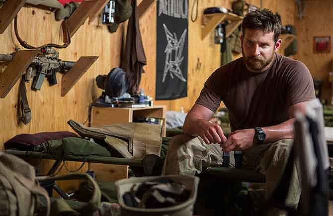 In this image released by Warner Bros. Pictures, Bradley Cooper appears in a scene from "American Sniper."