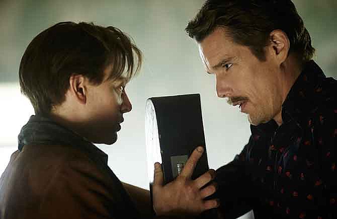 In this image released by Sony Pictures Worldwide Acquisitions, Sarah Snook, Left, and Ethan Hawke appear in a scene from the film, "Predestination."