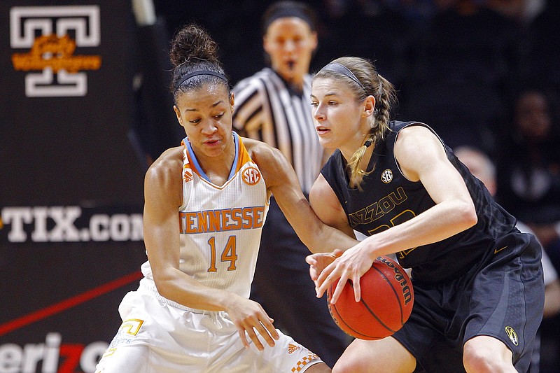 Jordan Frericks of Missouri battles Tennessee's Andraya Carter for control of the ball during a game earlier this month in Knoxville, Tenn.