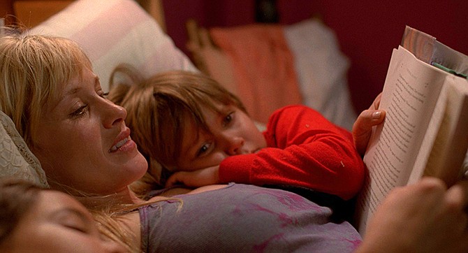 This image released by IFC Films shows Patricia Arquette and Ellar Coltrane in a scene from the film,"Boyhood."  