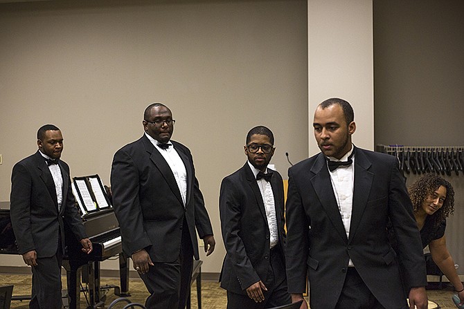 Members of the Lincoln University Vocal Ensemble take their seats after performing during the MLK Day Commemorative Service Monday afternoon at St. Mary's Hospital.