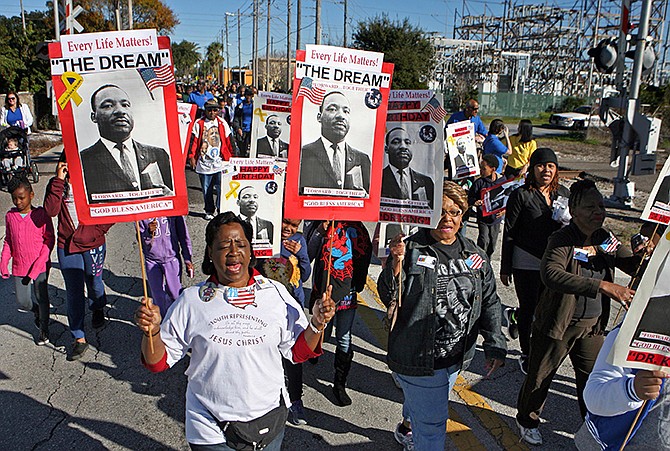Marchers from St. John Missionary Baptist Church march down N. Martin Luther King Jr. Ave. during the 31st Annual Martin Luther King Jr. Day Celebration in Clearwater, Florida on Monday. The event included a breakfast at the North Greenwood Recreation Center followed by a 10 a.m. march from the Recreation Center to Coachman Park for a rally with speeches and music. 