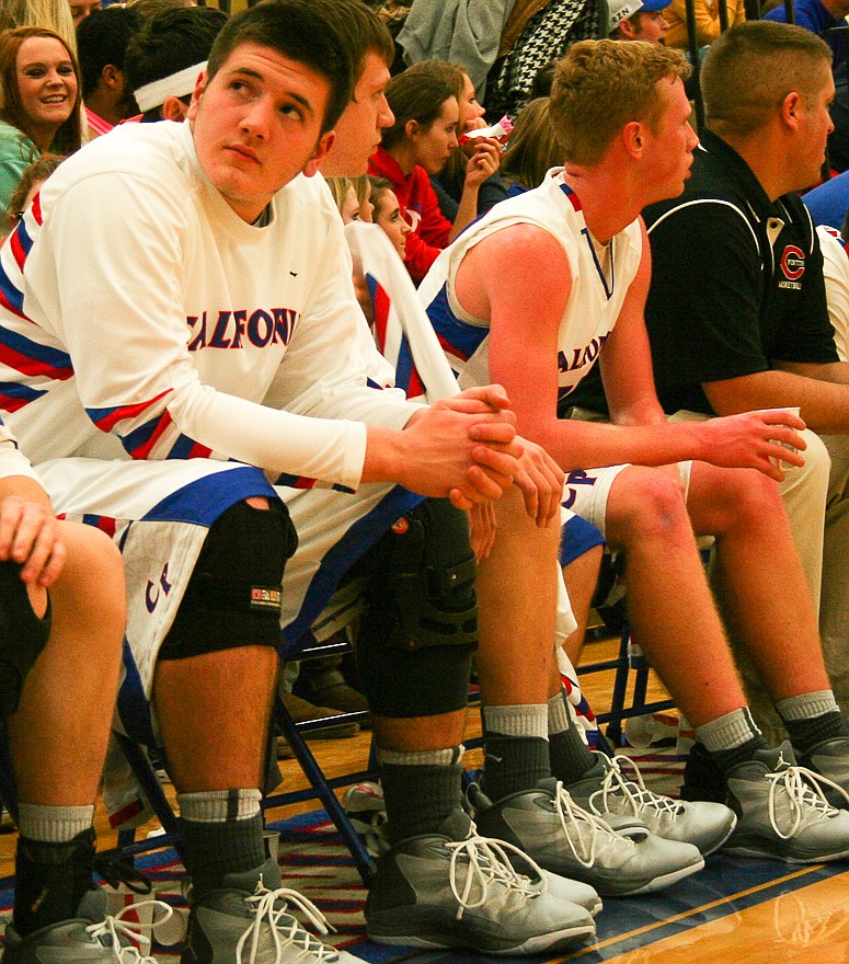 Pintos senior Damon Shaw (left) looks up at the scoreboard during Thursday's semifinal against Fatima at the California Basketball Tournament. Shaw, a starting forward, did not play at the tournament after suffering a right knee injury against Southern Boone on Friday, Jan. 9. He's expected to miss at least three weeks.