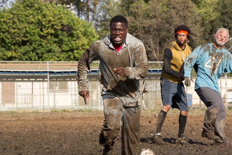 This photo released by Sony Pictures Entertainment, Inc. shows, Kevin Hart, center, as Jimmy, in a scene from Screen Gems' "The Wedding Ringer."