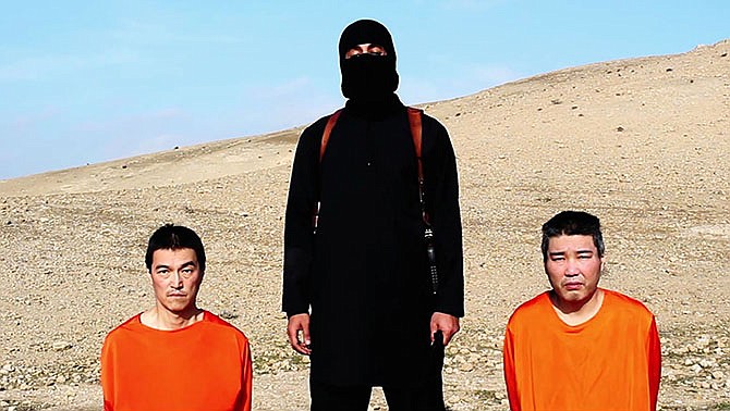 This image taken from an online video released by the Islamic State group's al-Furqan media arm on Tuesday, Jan. 20, 2015, purports to show the group threatening to kill two Japanese hostages that the militants identify as Kenji Goto, left, and Haruna Yukawa, right, unless a $200 million ransom is paid within 72 hours. In August, a Japanese citizen believed to be Yukawa, a private military company operator in his early 40s, was kidnapped in Syria after going there to train with militants. Goto is a Japanese freelance journalist who went to report on Syria's civil war last year.